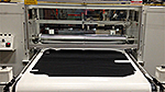 This Union Hot Melt Roller Coater was specifically designed to apply hot melt adhesives to interior automotive carpet materials. 
